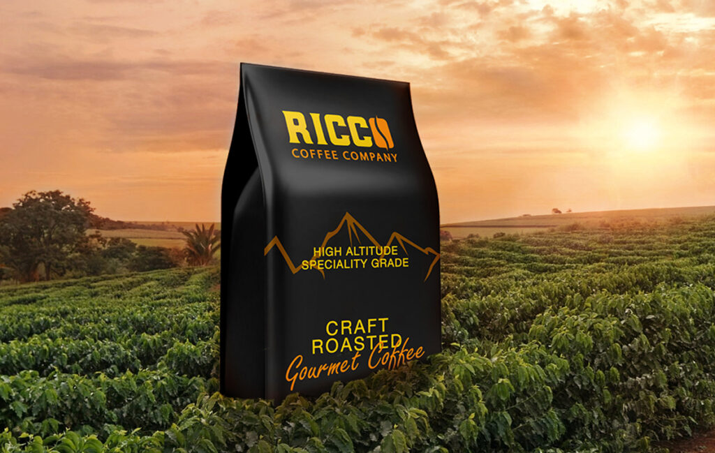 Ricco Coffee – Single Origin Bag in Mountain Farm at Sunrise Ricco Coffee Company bag set in a high-altitude coffee farm at sunrise, representing single origin, farm-specific specialty coffee grown in mountainous regions