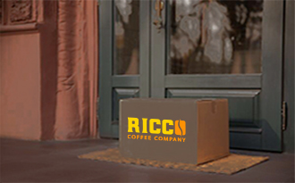 Ricco Coffee delivery box placed at a customer’s doorstep, symbolizing free home delivery with subscription