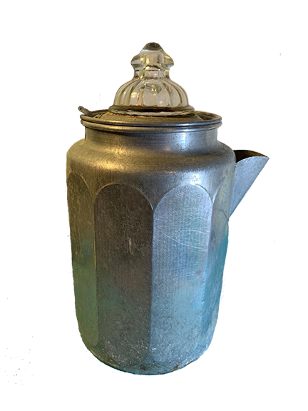 A classic vintage stove-top percolator, tarnished with age, evokes a sense of nostalgia with its timeless design and glass top. This image epitomizes the unique charm of traditional coffee brewing, highlighting the anticipation of hearing the distinctive percolating sound and smelling the aromatic brew it produces, reminiscent of a past where craftsmanship was paramount in household appliances. Its ability to create a strong, bold flavor akin to espresso is celebrated by coffee aficionados seeking the rich, authentic experience of vintage percolator brewing.